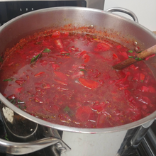 Load image into Gallery viewer, A pot of beet borsch tangy and hearty vegetable soup
